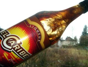El Caribe mocca liqueur bottle against a dull February landscape El Caribe mocca liqueur bottle against a dull February landscape