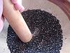 Grinding sesame in a suribachi 1 Grinding sesame in a suribachi 1