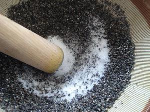Grinding sesame in a suribachi 2 Grinding sesame in a suribachi 2