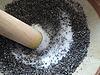 Grinding sesame in a suribachi 2 Grinding sesame in a suribachi 2