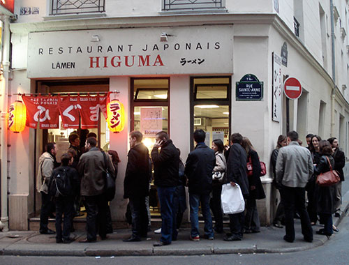IMG: Lining up for ramen (lamen) in Paris.